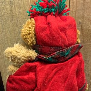 Christmas teddy bear holding puppy and purse